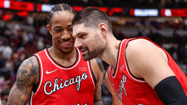 Chicago Bulls center Nikola Vucevic celebrates with forward DeMar DeRozan